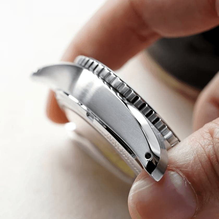 A Hitori case held between finger and thumb